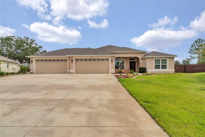Front view of home with 4 car garage