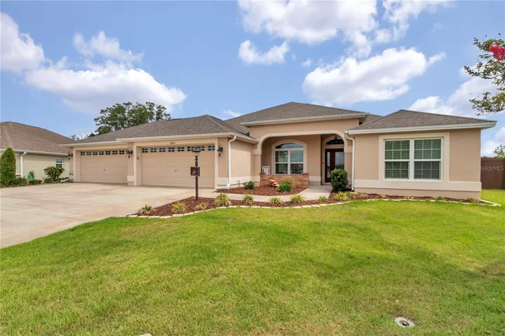 Front view of home with 4 car garage