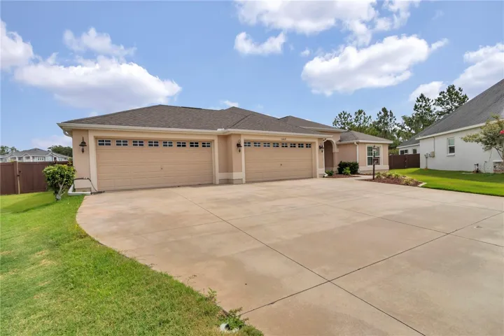 Front view of home with 4 car garage