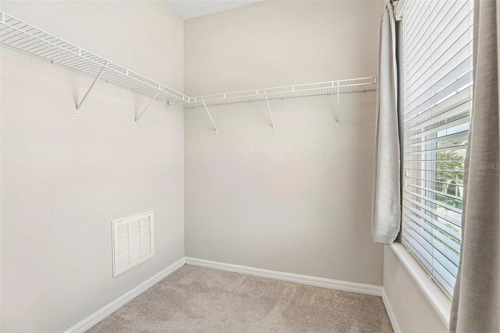 Primary suite walk-in closet.
