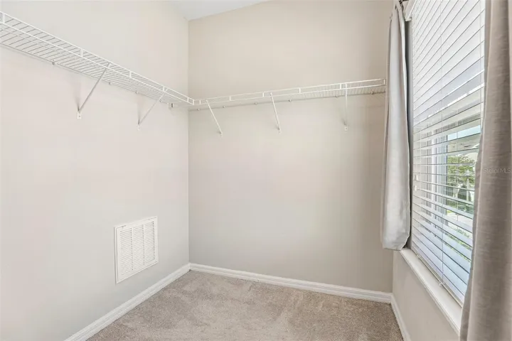 Primary suite walk-in closet.