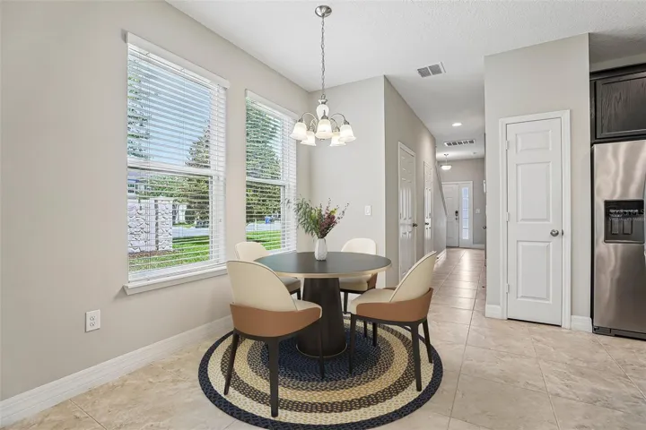 The end-unit location is a standout feature, offering EXTRA WINDOWS, a large SIDE YARD, and abundant NATURAL LIGHT throughout. Virtually Staged.