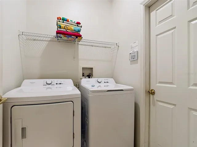 Laundry Room with Full-Size Washer and Dryer