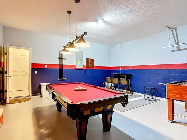 Game Room with Pool Table and Entertainment Area
