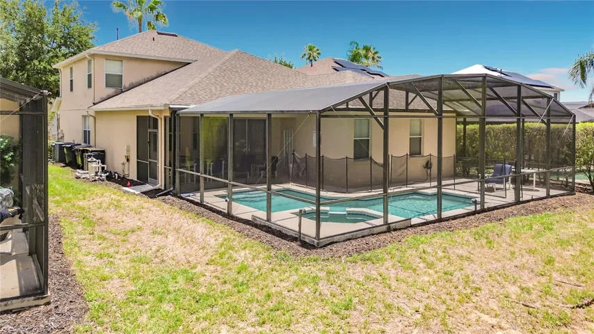 Private Backyard Setting with Screen-Enclosed Pool