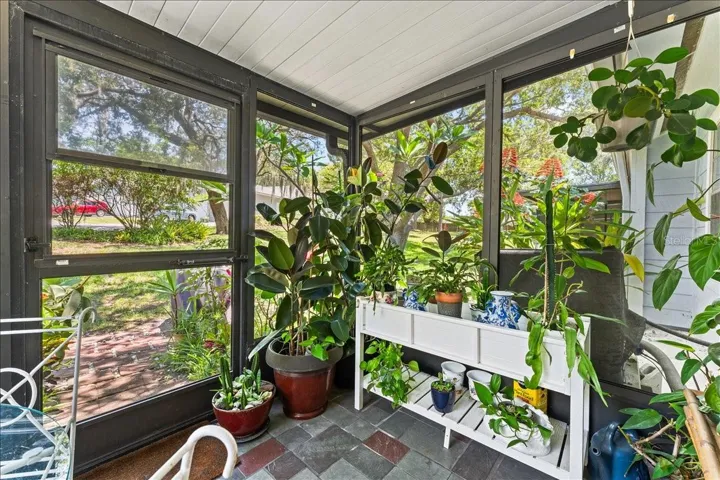 Screened porch with access to back garden