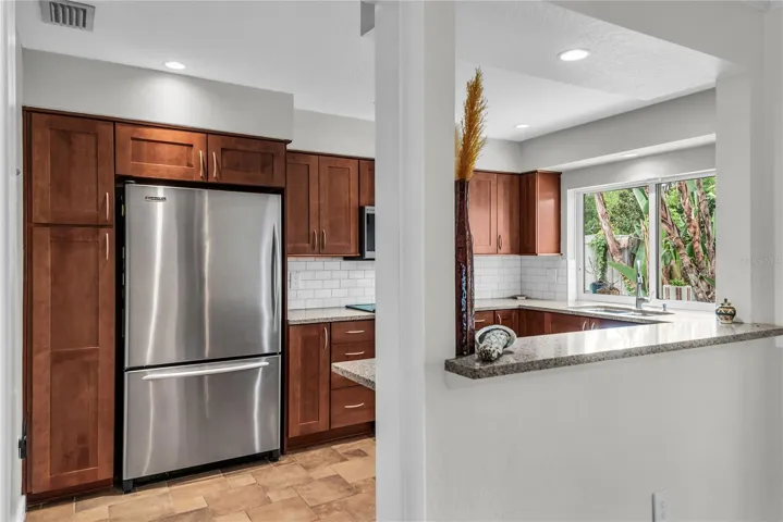 Kitchen with stainless steel appliances and granite counters