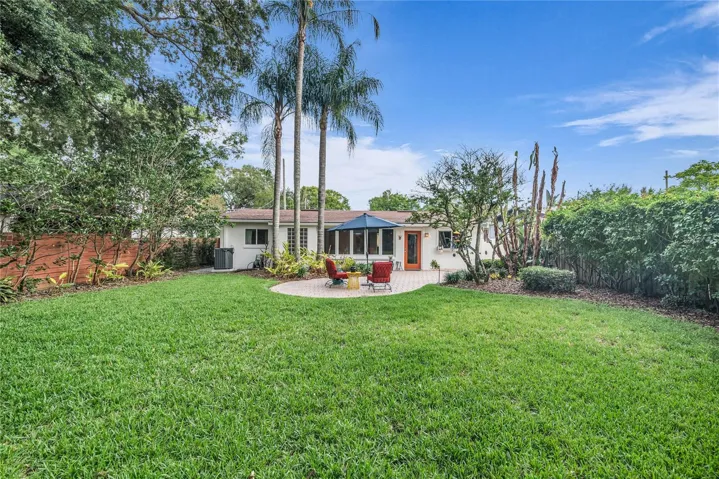 Spacious fenced backyard with paver patio