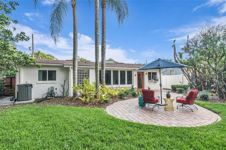 Spacious fenced backyard with paver patio