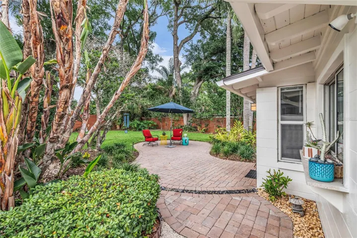Spacious fenced backyard with paver patio