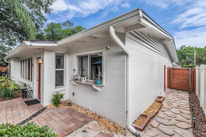 Spacious fenced backyard with paver patio
