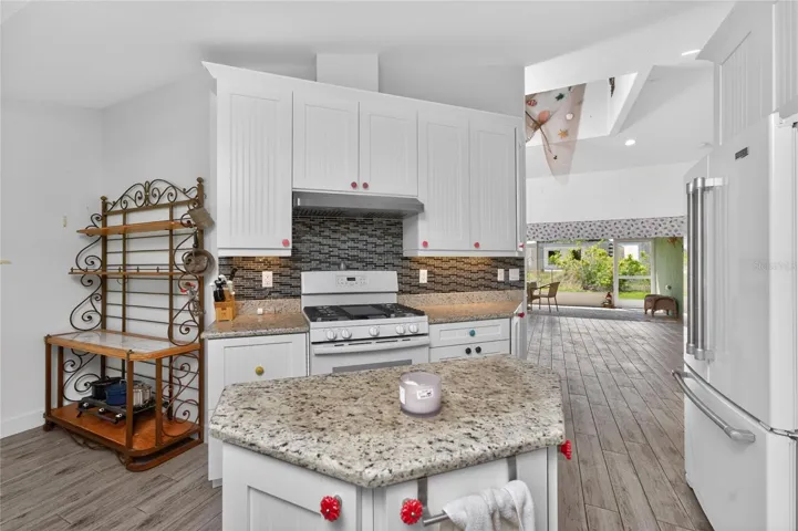 The tiled backsplash is an added bonus! The island provides an additional prep and storage area.