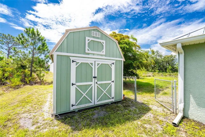 The shed offers additional storage.