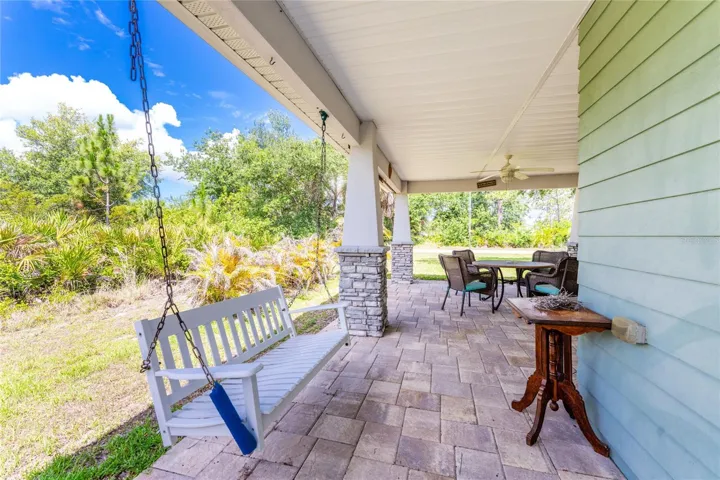 The porch swing is an added bonus to this covered front porch!