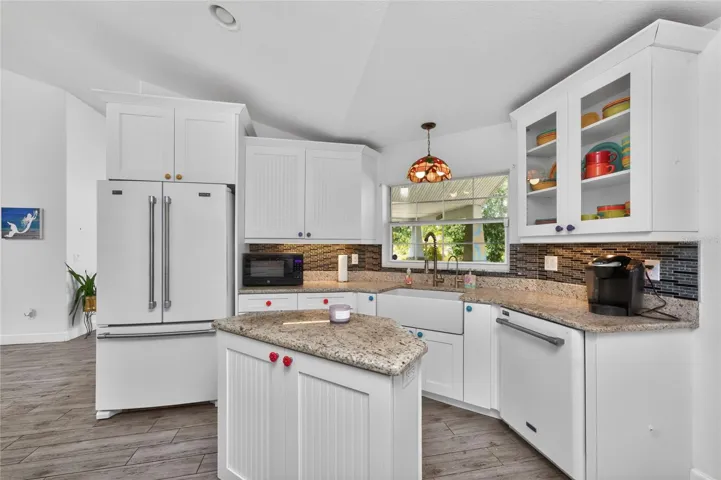 The kitchen features a Maytag French door refrigerator, a Maytag dishwasher and Farmhouse sink.