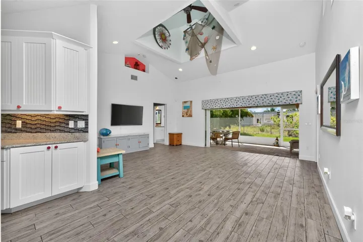 The living room features a cupola with a ceiling fan, adding lots of lighting and a unique feature!