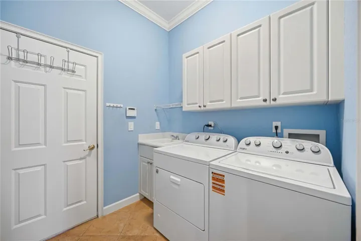 Inside Laundry with cabinet storage