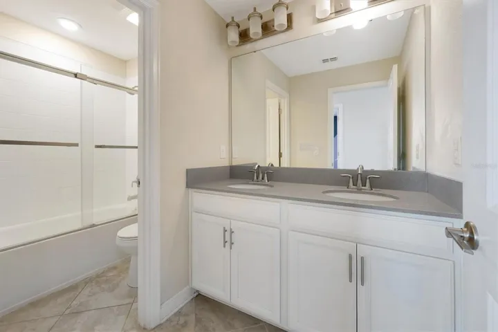 Full Bathroom 3 upstairs with dual-sink on elevated vanities