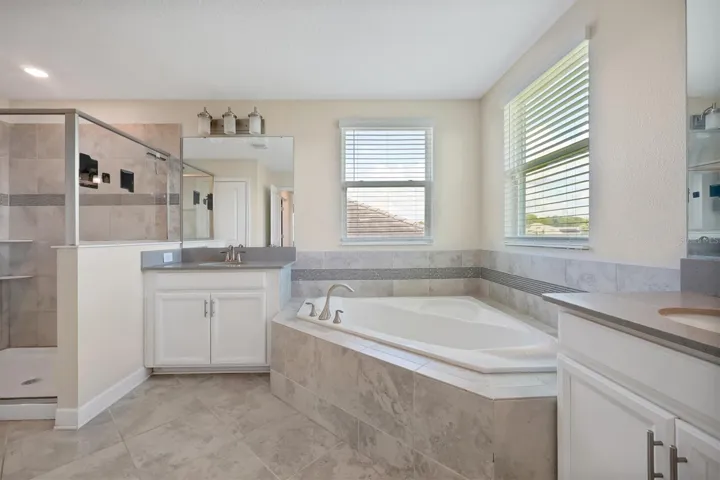 Primary Bathroom w/ dual-sink and plenty of natural lighting
