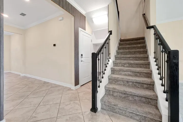 Garage door entrance/drop zone area/stairs to upstairs living