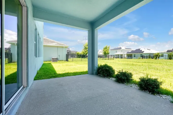 Covered Lanai with spacious backyard