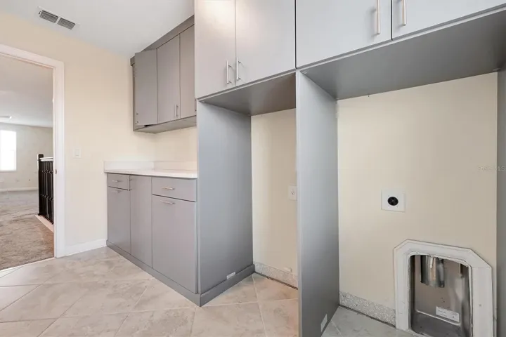 Laundry Room with custom-built cabinets