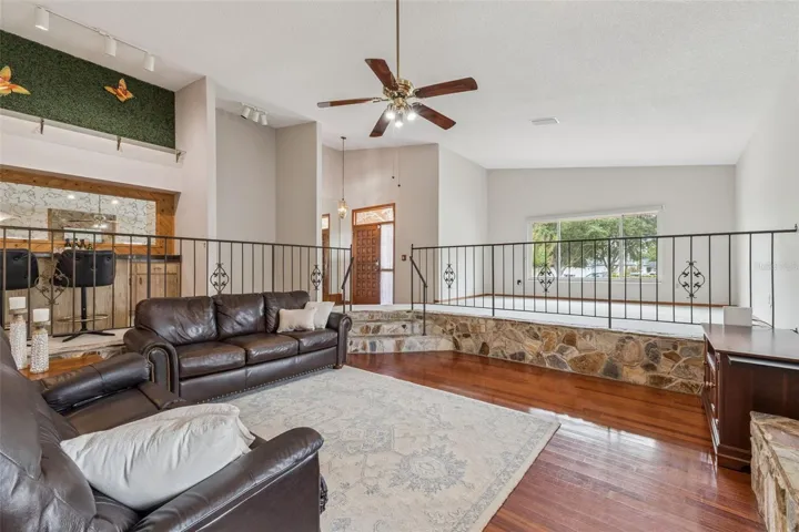 Note the elevated bar with seating, bar fridge and wet bar.  Additional flex living space overlooks the front yard.