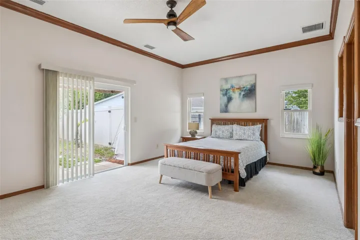 Sliding glass door leading out to the peaceful courtyard area with spa.