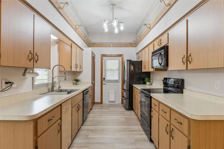Galley-style kitchen, close to the back door for easy access to your grilling and entertaining!!