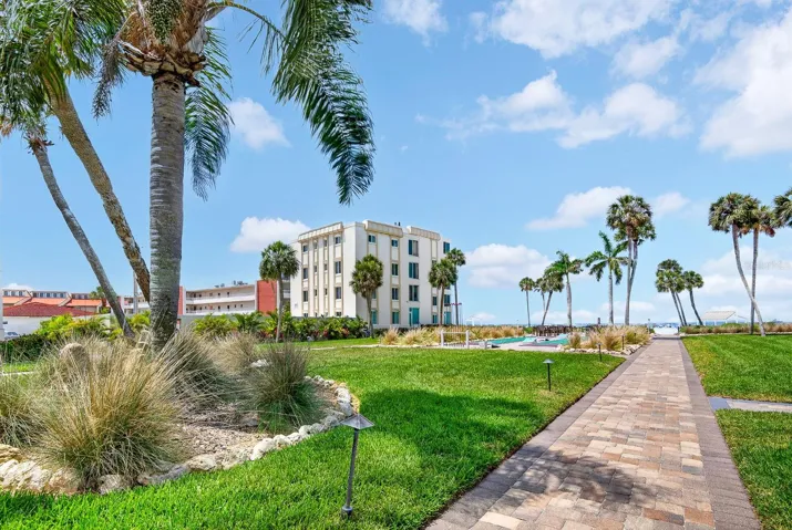 Walk way in between buildings to shuffleboard area and beach