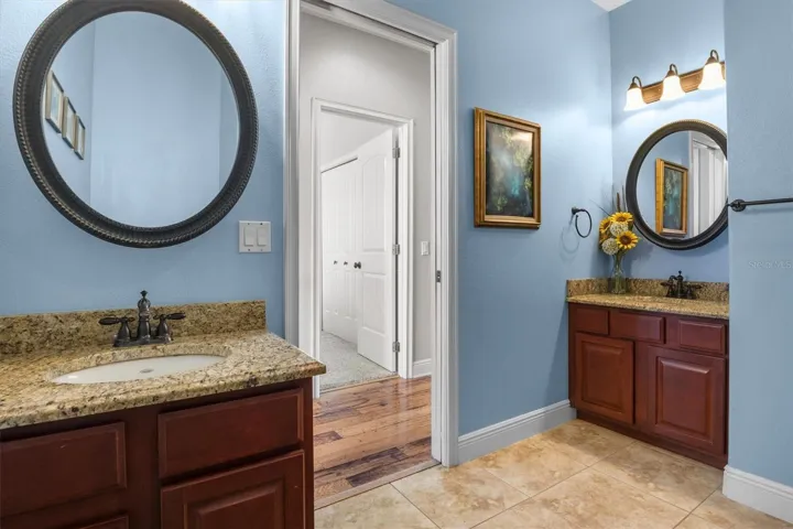 Hallway bathroom by Bedrooms 2,3,4. Tub/shower combo, dual vanity sinks with granite countertops