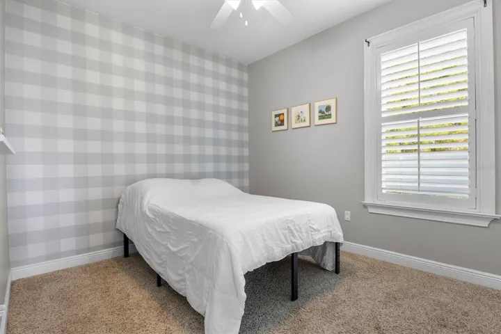 Bedroom 2 with built in closet, plantation shutters
