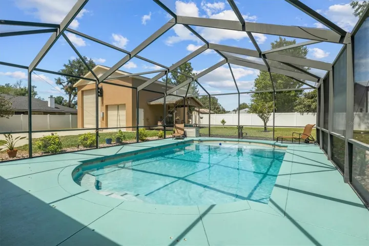 Salt water pool, recently painted pool deck, covered sitting area,