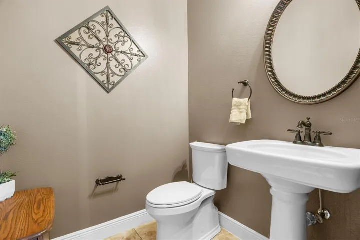 Half bathroom located by the entryway door
