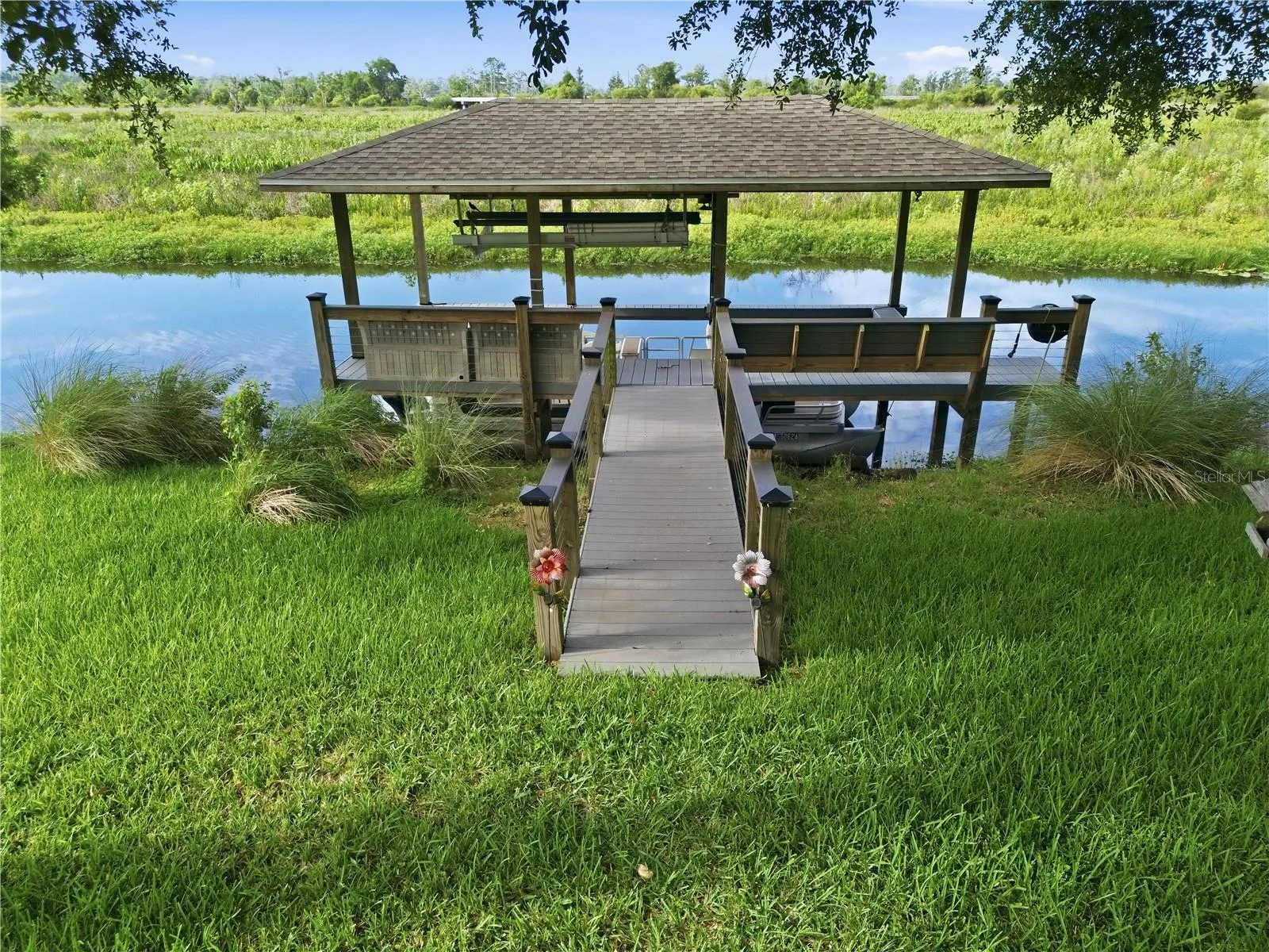 Private Boat lift with space for both a boat and a personal water craft.