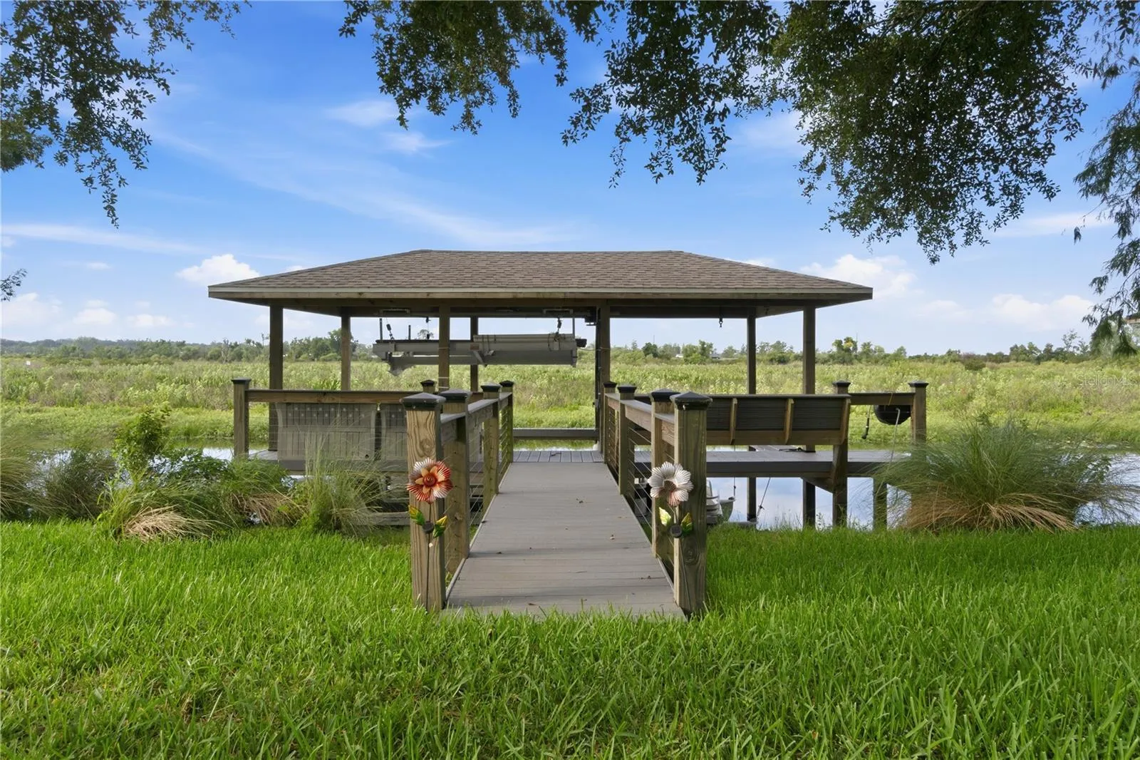 Private Boat lift with space for both a boat and a personal water craft.