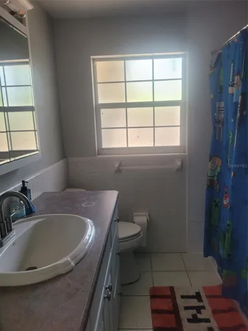 Second full bathroom with tub and shower
