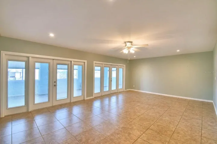 facing dining room doors to sunroom