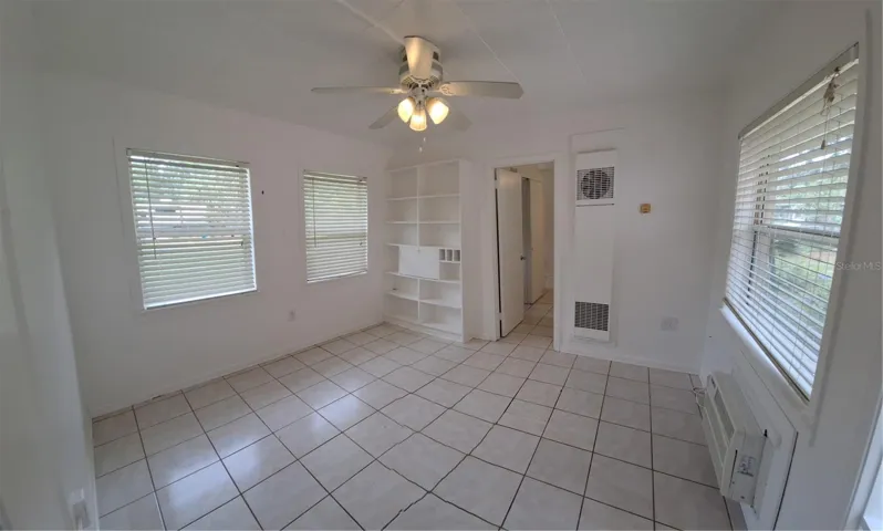 Living room showing doorway to bedroom