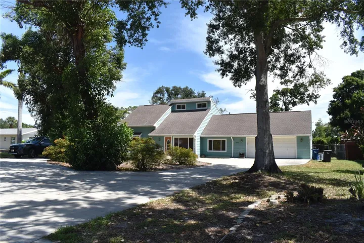 Front of House with Oversized 2 car Garage &amp; a circular Driveway