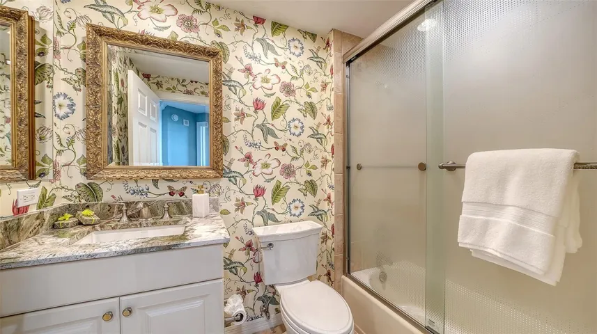 The full guest bath features elegant details and timeless design.