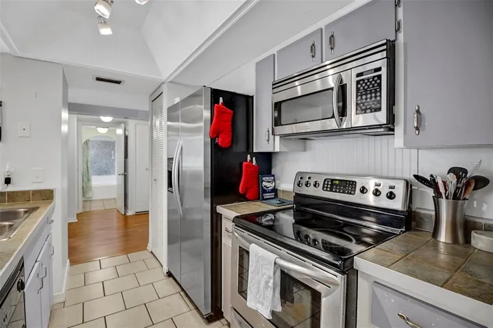 Kitchen Before New Granite Counter Tops and Cabinet Paint