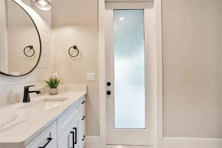 Thoughtfully designed bathroom with quartz countertops, modern fixtures, and a bright, airy layout.