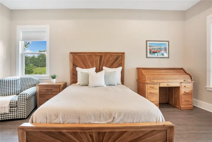 Owner's retreat offering abundant natural light, peaceful golf course community views, and a spacious, relaxing atmosphere.
