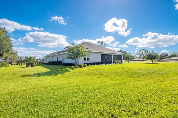 Large backyard with ample space for recreation, pets, gardening, or future outdoor enhancements, all overlooking the golf course.