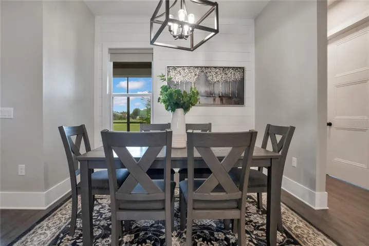 Dedicated dining area conveniently located adjacent to the kitchen, providing the perfect setting for family meals and special gatherings.