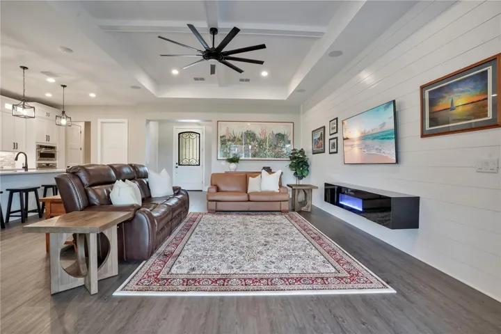 Open living and entertaining space showcasing custom finishes, abundant natural light, and a functional floor plan designed for modern living.