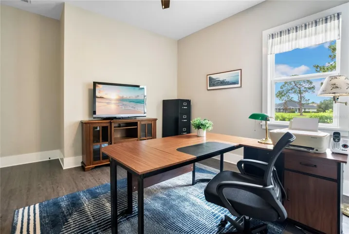 Third bedroom or private home office or flex space with large window, ideal for remote work, study, or a dedicated hobby room.