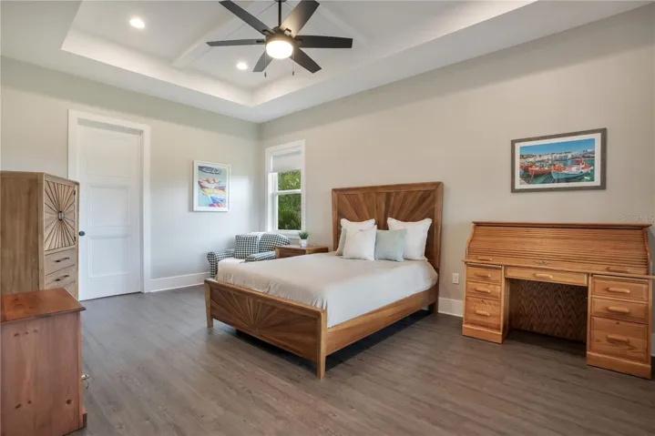 Large primary bedroom with premium finishes, spacious layout, and direct access to the luxurious ensuite bathroom.