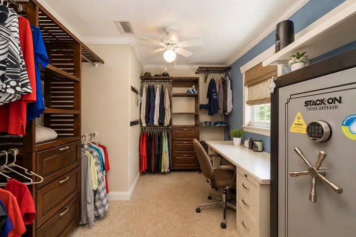 Walk-in closet for primary bedroom.